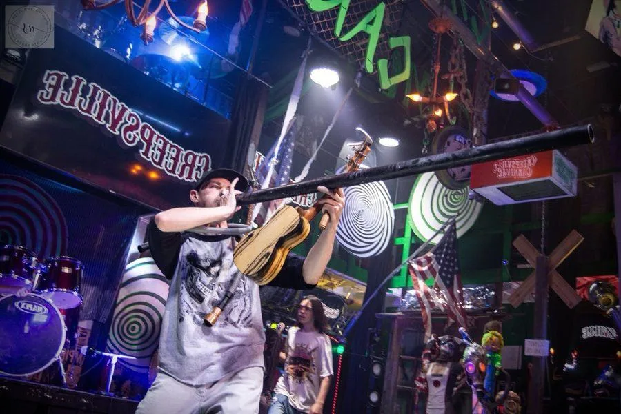 Ryan Today playing didgeridoo on stage