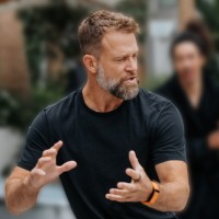 Miles Lukas speaking with his hands while teaching